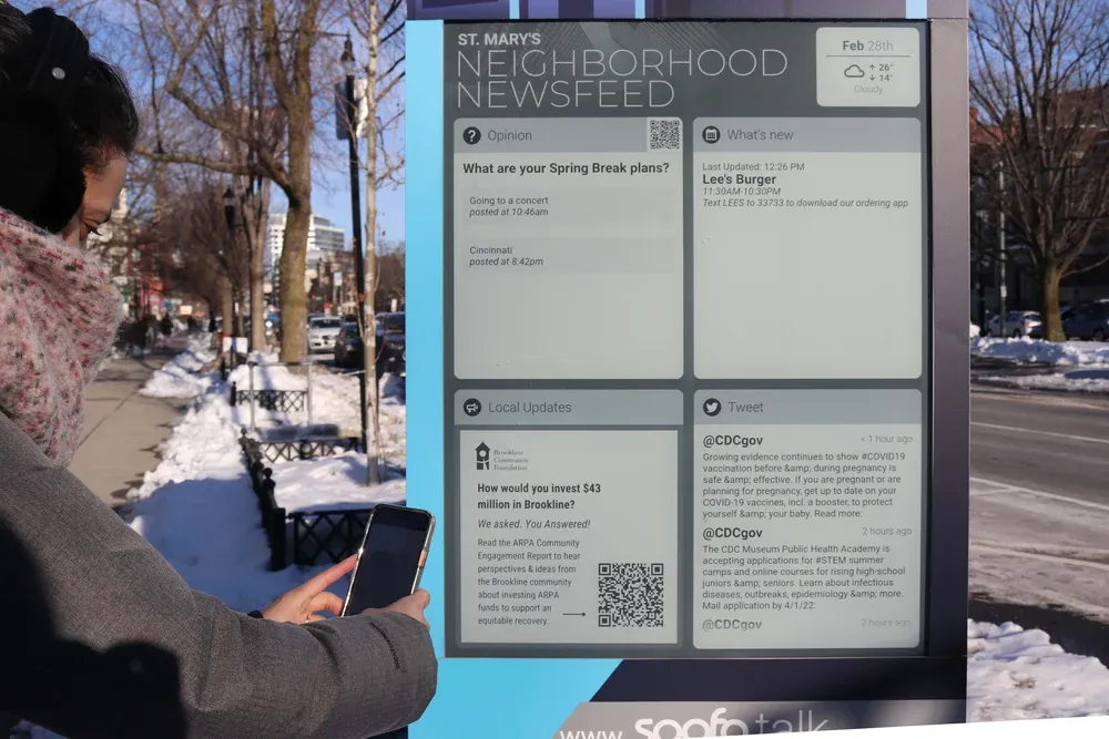 Soofa Sign with St. Mary's Neighborhood Newsfeed in winter